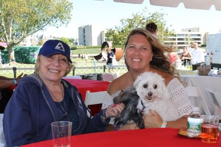 Adopt-A-Dog founder Donna Nives with Greenwich attendee Lis Suppo and her pups Alma and Bella at the 28th Annual Puttin’ on the Dog