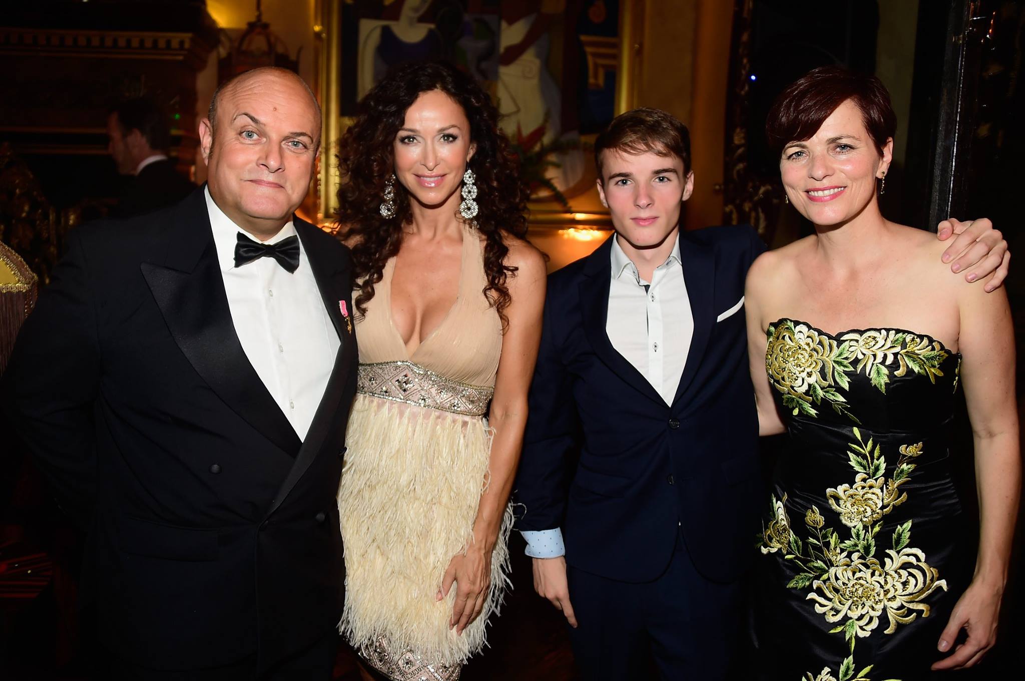 Former BAFTA Chairman of the Board, Nigel Daly, OBE, actress Sofia Milos (wearing SUE WONG), Max Daly and wife of Nigel Daly, filmmaker Louise Salter (wearing SUE WONG)