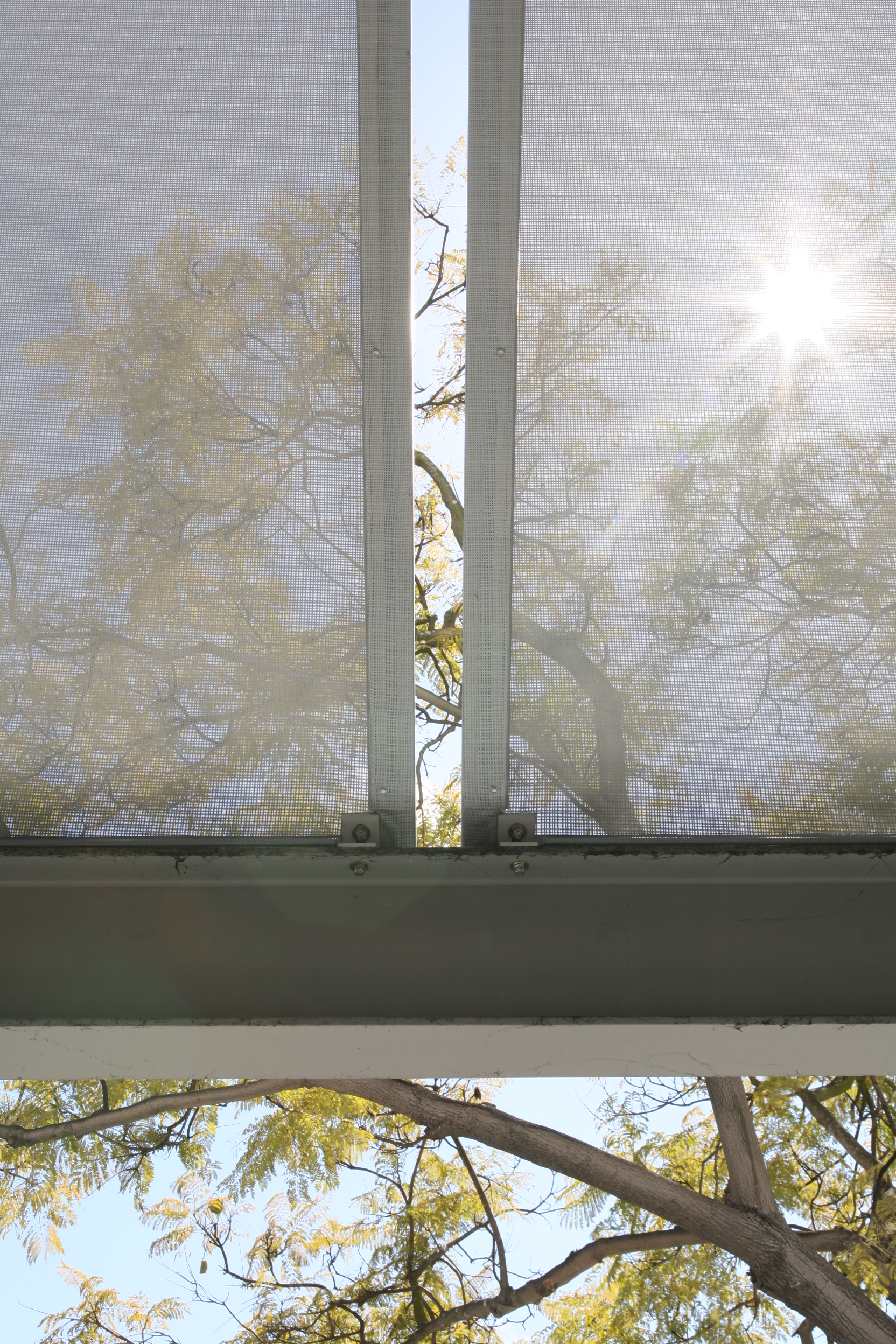 Natural light shines through - Serge Ferrari's Soltis FT 371 used as an awning over a walkway ~ X-Ten Architects and J. Miller Canvas