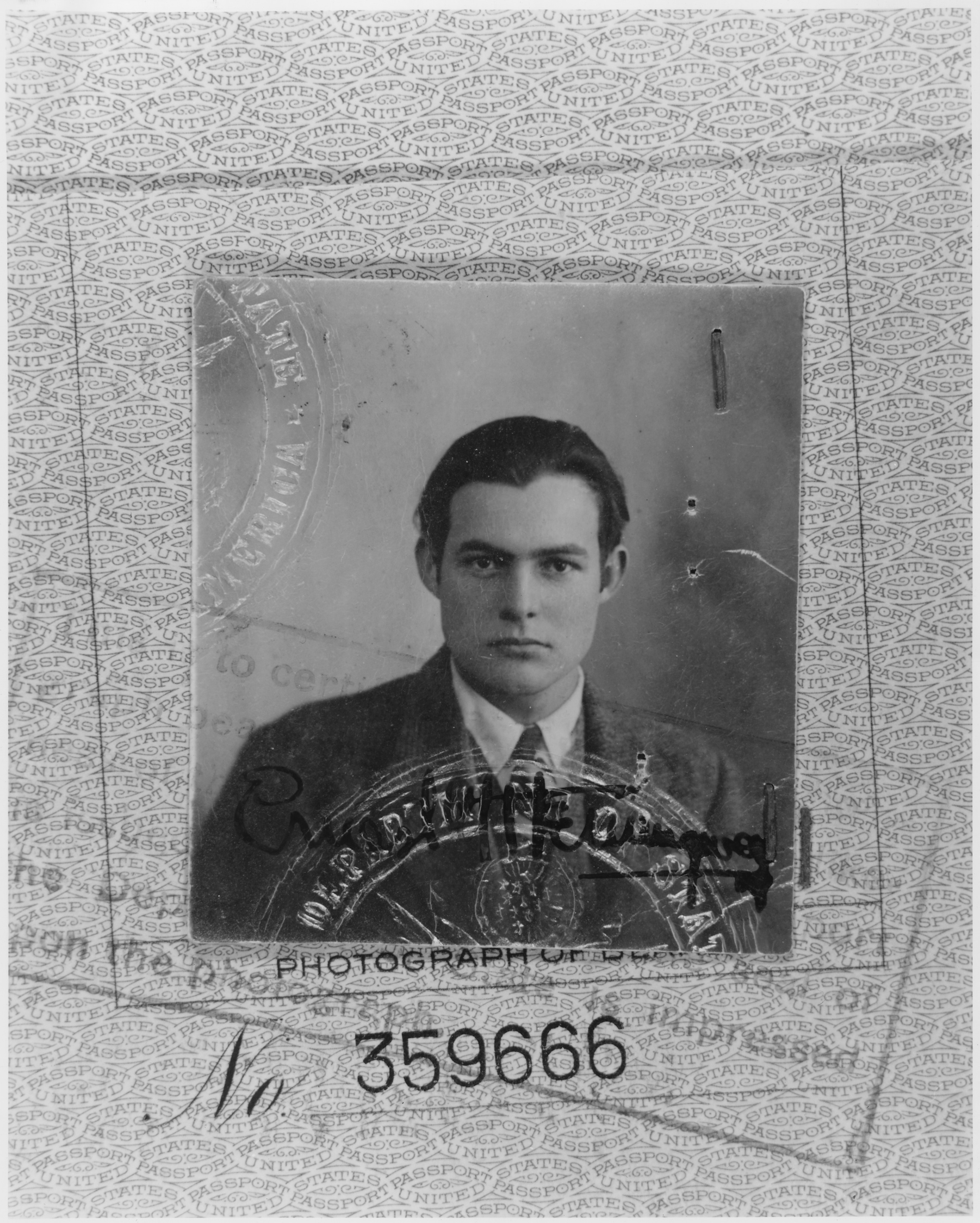 A 1923 passport photo of Ernest Hemingway who found writing inspiration in Paris. Left Bank Writers Retreat visits many Hemingway Parisian haunts.