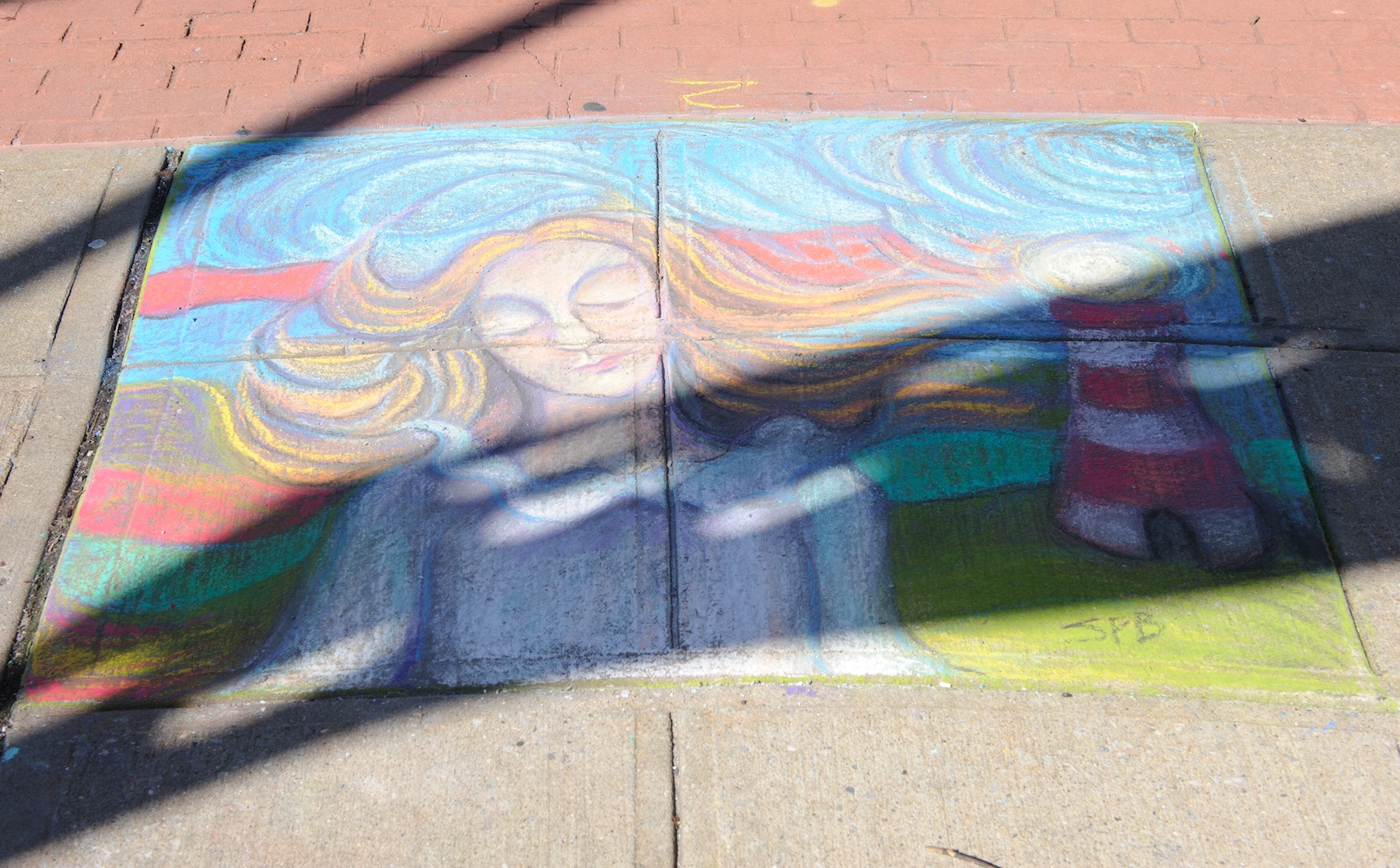 Local artist Shirley Benavides received first place at the Village of Ossining’s second annual Chalk It Up! festival held recently at Market Square. Photo by: Michael Lee.