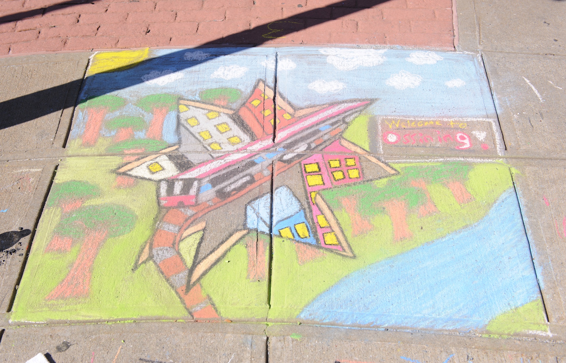 Local artists Julian Negron and Alex Quishpi received second place at the Village of Ossining’s second annual Chalk It Up! festival held recently at Market Square. Photo by: Michael Lee.