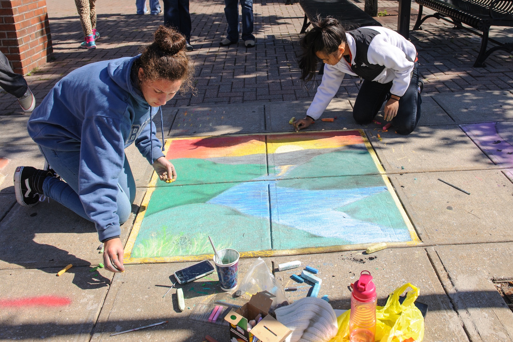 Ossining High School student artists Mae Jiminez and Jen Mielke tied for third place at the Village of Ossining’s second annual Chalk It Up! festival held recently at Market Square. Photo by: Michael