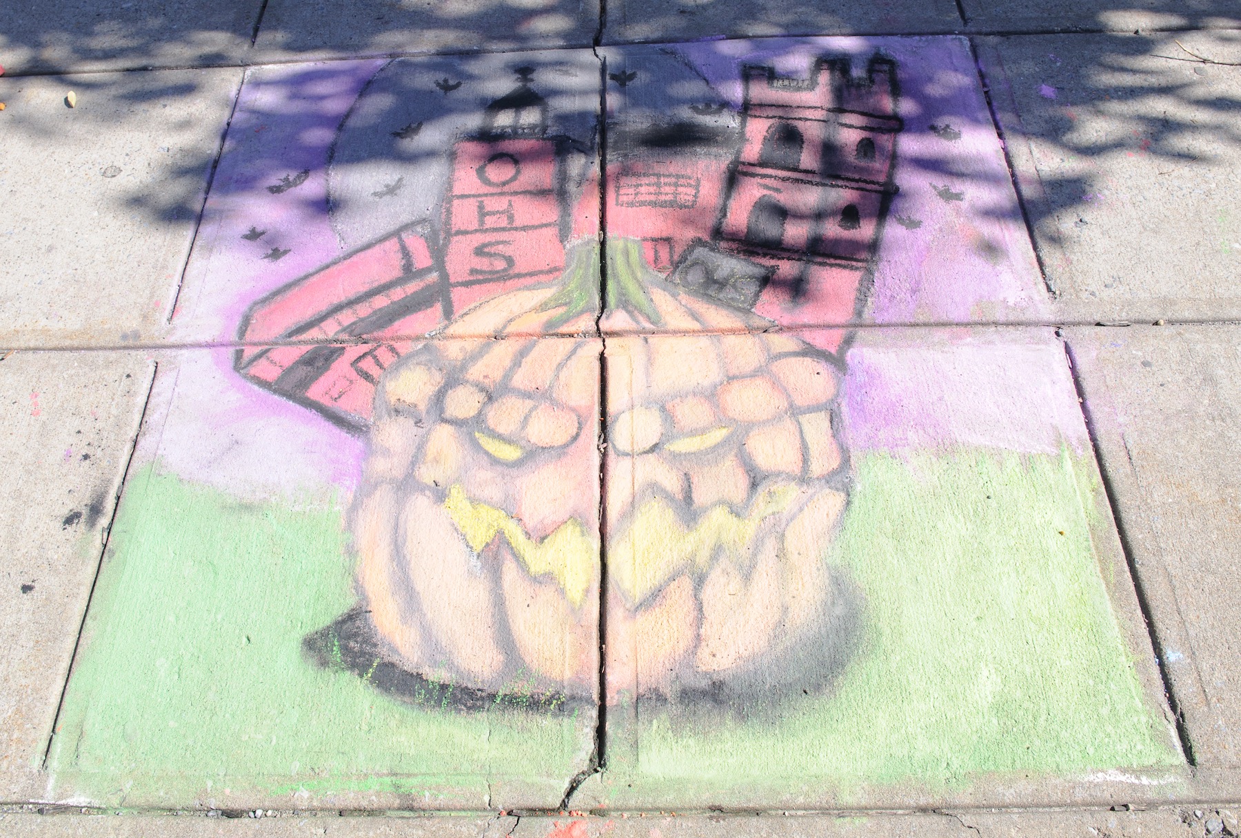 Ossining High School student artists Kabi Boukari, Jaiyee Webb and Ana Casteneda tied for third place at the Village of Ossining’s second annual Chalk It Up! festival held recently at Market Square.