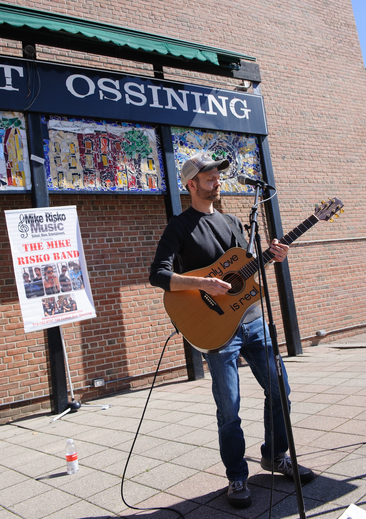Singer/musician Adam Love performs at the Village of Ossining’s second annual Chalk It Up! festival held recently at Market Square. Photo by: Michael Lee.