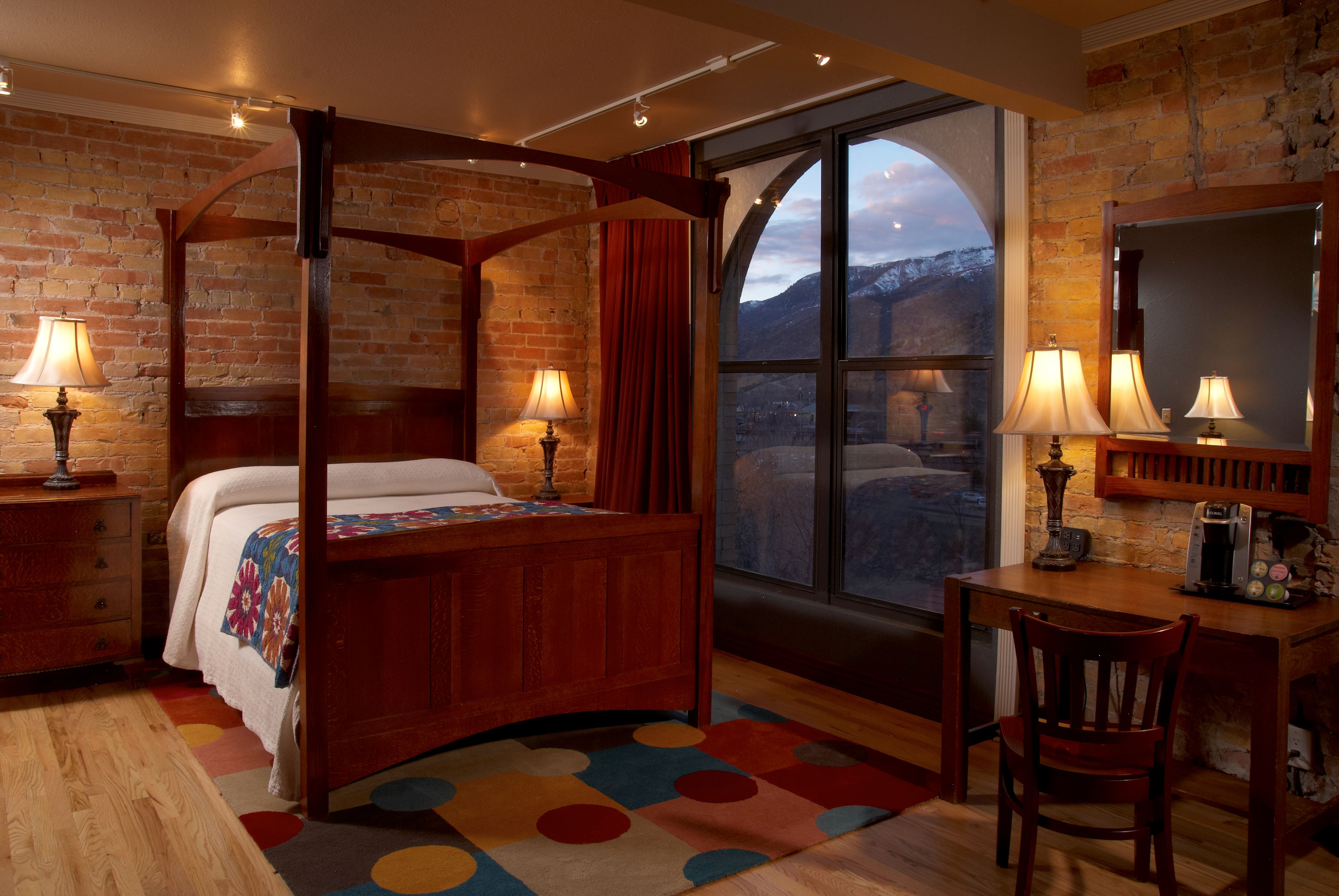 Cozy quilts and antiques warm each guest room at The Hotel Denver, which also offers modern conveniences including free wireless and high-definition televisions.