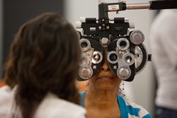 Picture of a Care Harbor patient receiving a free vision screening