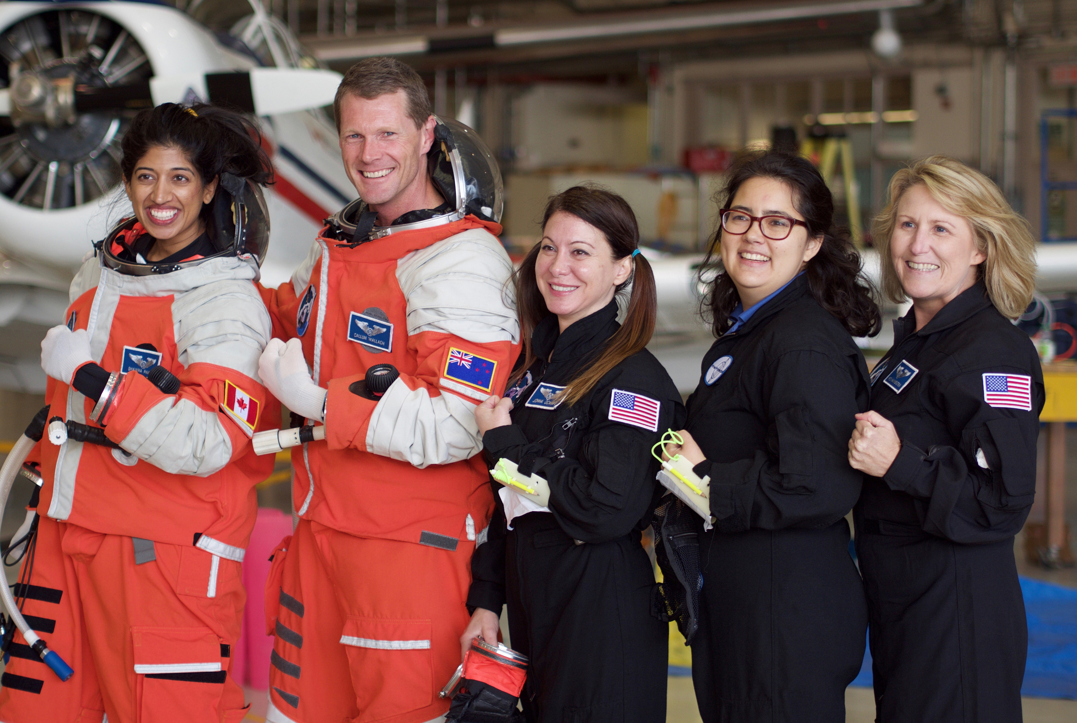 (L-R) Project PoSSUM flight research team members Shawna Pandya, Callum Wallach, Jonna Ocampo, Kari Love, and Heidi Hammerstein after successful spacesuit evaluation in zero-g. (Project PoSSUM PR)