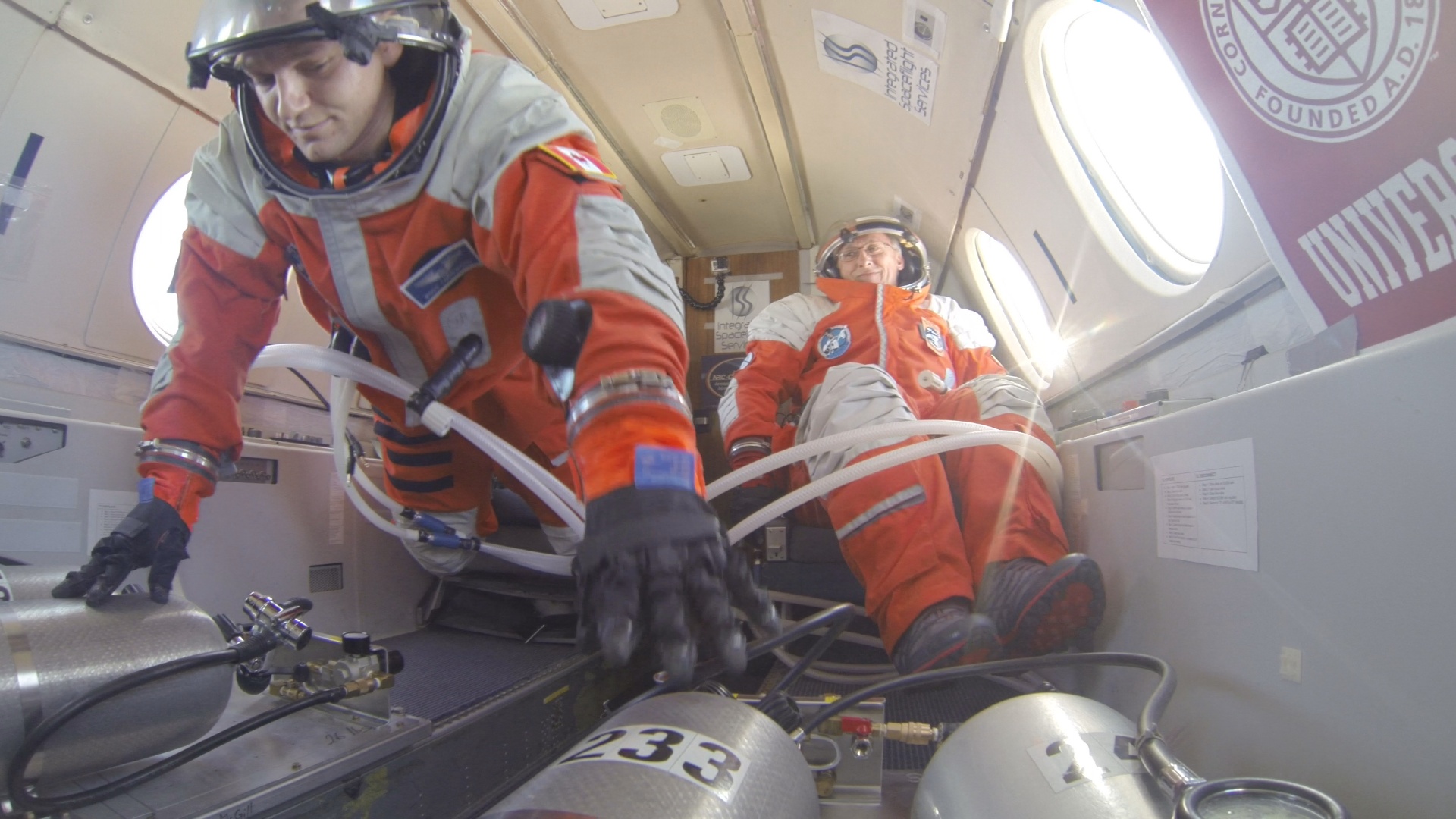 Project PoSSUM flight researcher Dr. Ross Lockwood tests seat ingress and egress procedures while in microgravity conditions (Project PoSSUM PR)