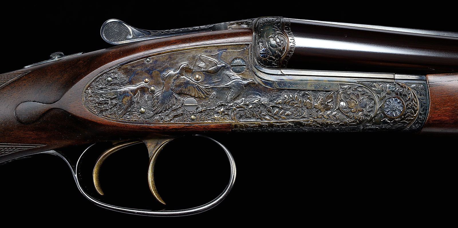 Exceptional Ken Hunt Relief Sculpted James Purdey cal .410 Sidelock Ejector Game Gun; estimated at $80,000-120,000, sold for $103,500.