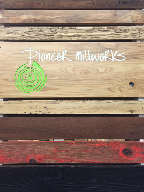 Pioneer Millworks’ updated exhibit showcases a wide variety of the reclaimed wood species and finishes they offer, including a panel of knocked-back red paint on Mushroom Board.
