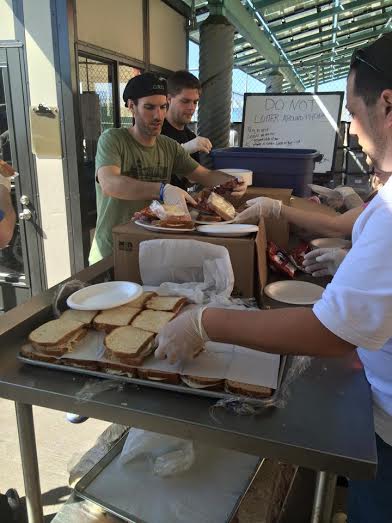 Mike Abramowitz hands out sandwiches