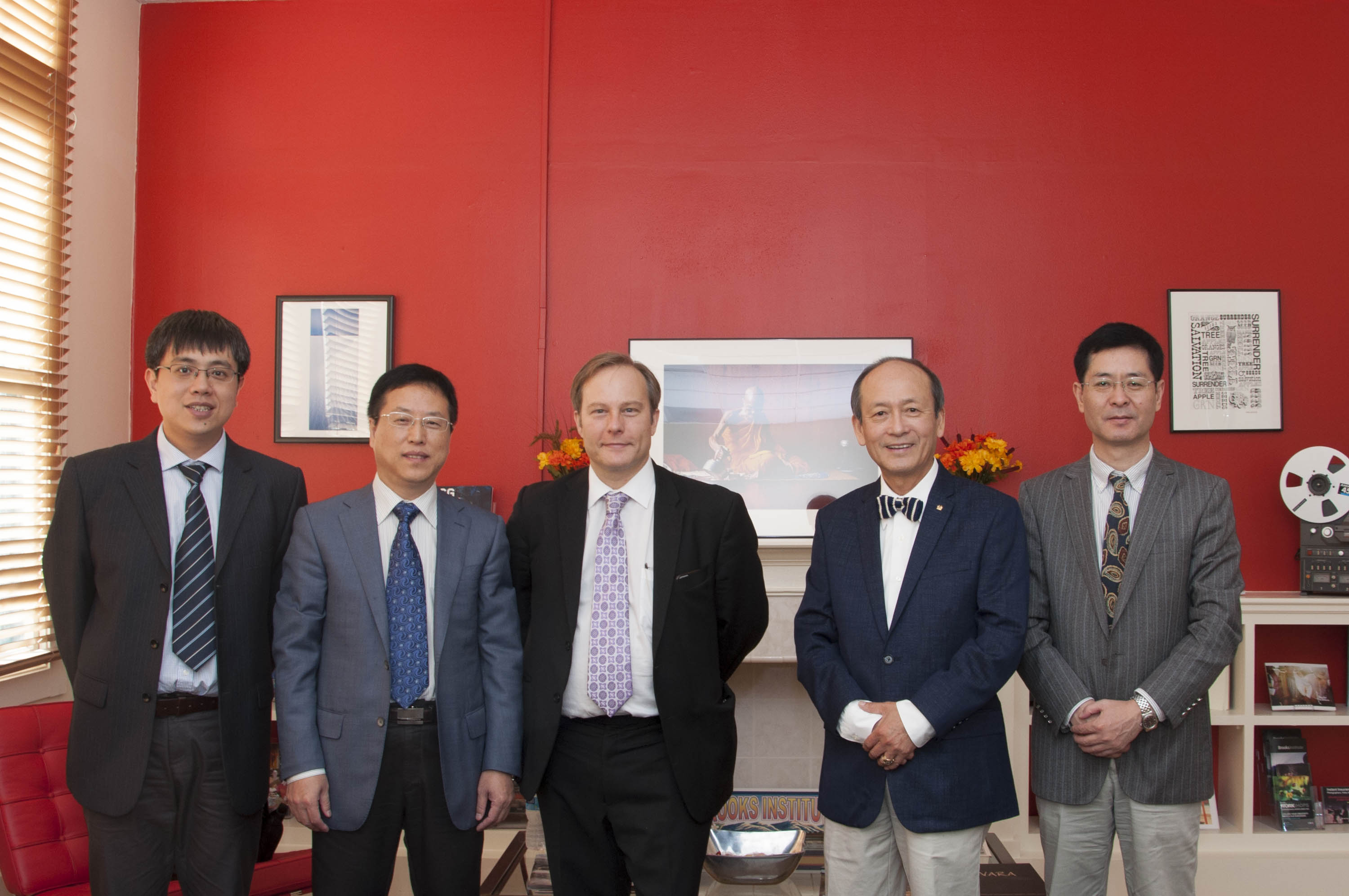 Yang Liu, Deputy Dean of the Department of International Cooperation and Exchange (left), Shengwei Zhao, Vice President (second from left), Brooks President Edward Clift (middle), Mr. Winston Zi Li, B
