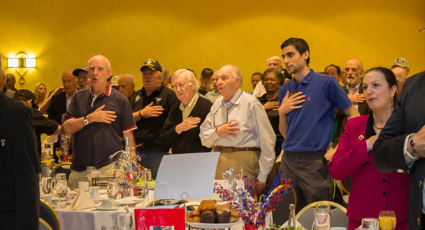 Veterans and supporters participate in the Pledge of Allegiance during the sixth annual Veterans Breakfast at the Westchester Marriot in Tarrytown.
