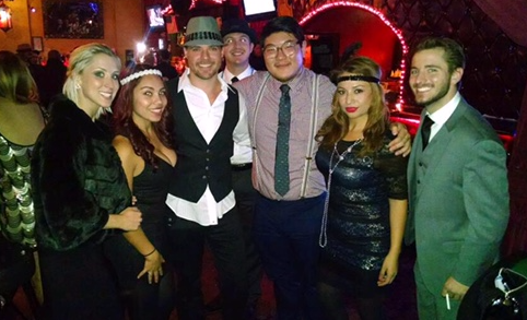 Team members of Fenix Consulting Group in Roaring 20's fashion