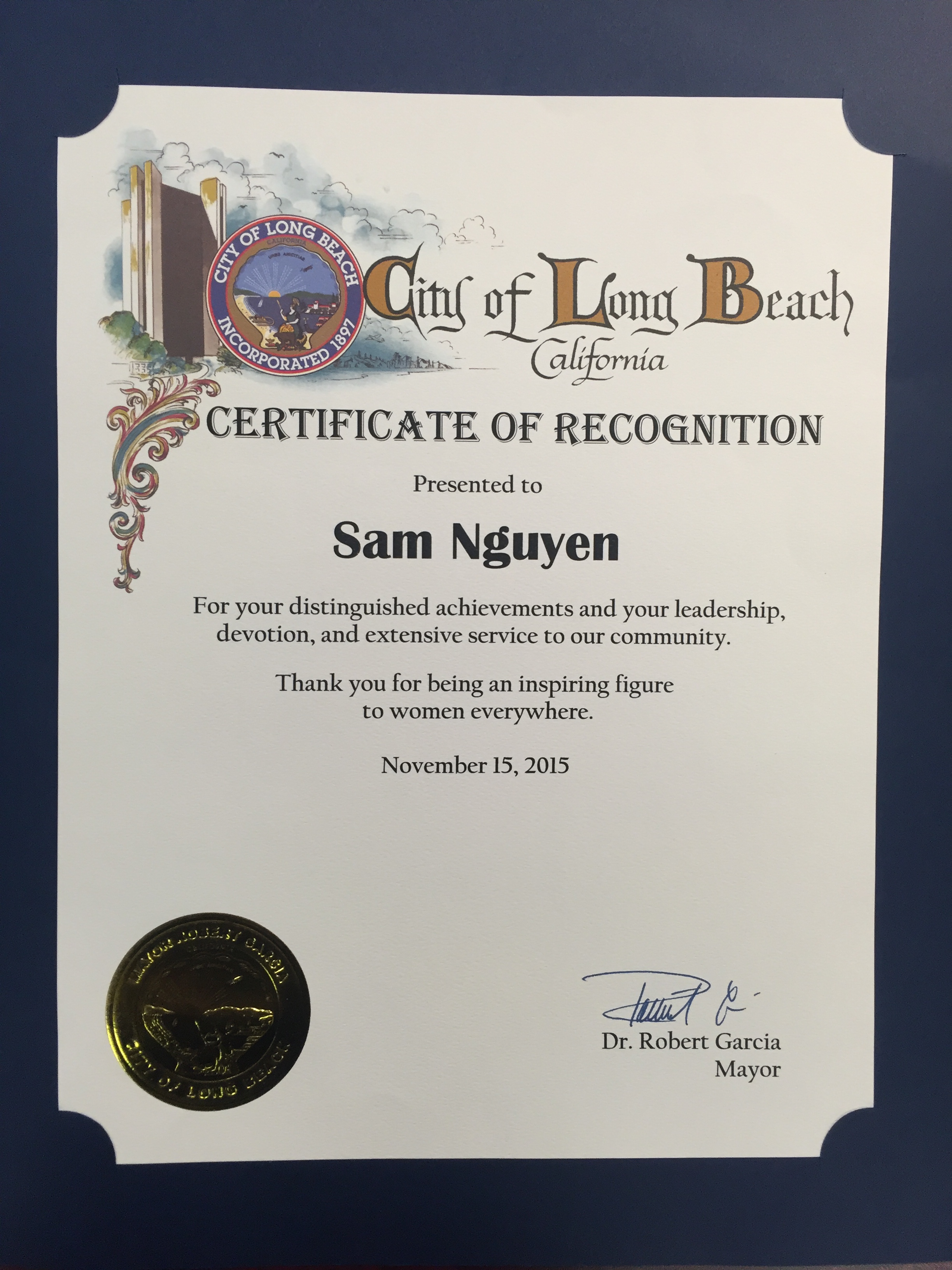 Sam Nguyen-Di Ai Hong Sam recieves a Certificate of Recognition from Long Beach Mayor Robert Garcia