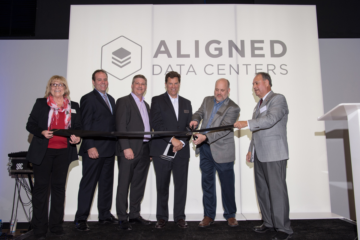 Jakob Carnemark, CEO of Aligned Energy, cuts ribbon marking the official opening of Aligned Data Centers ultra-efficient inaugural data center in Plano, Texas