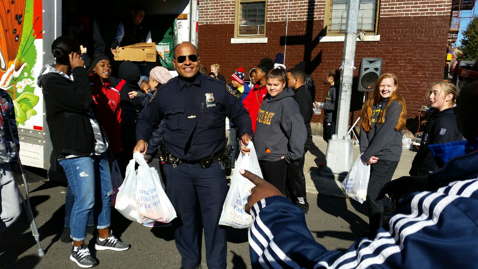 Officers from the 52 Precinct and Students from Long Island Lend a Helping Hand
