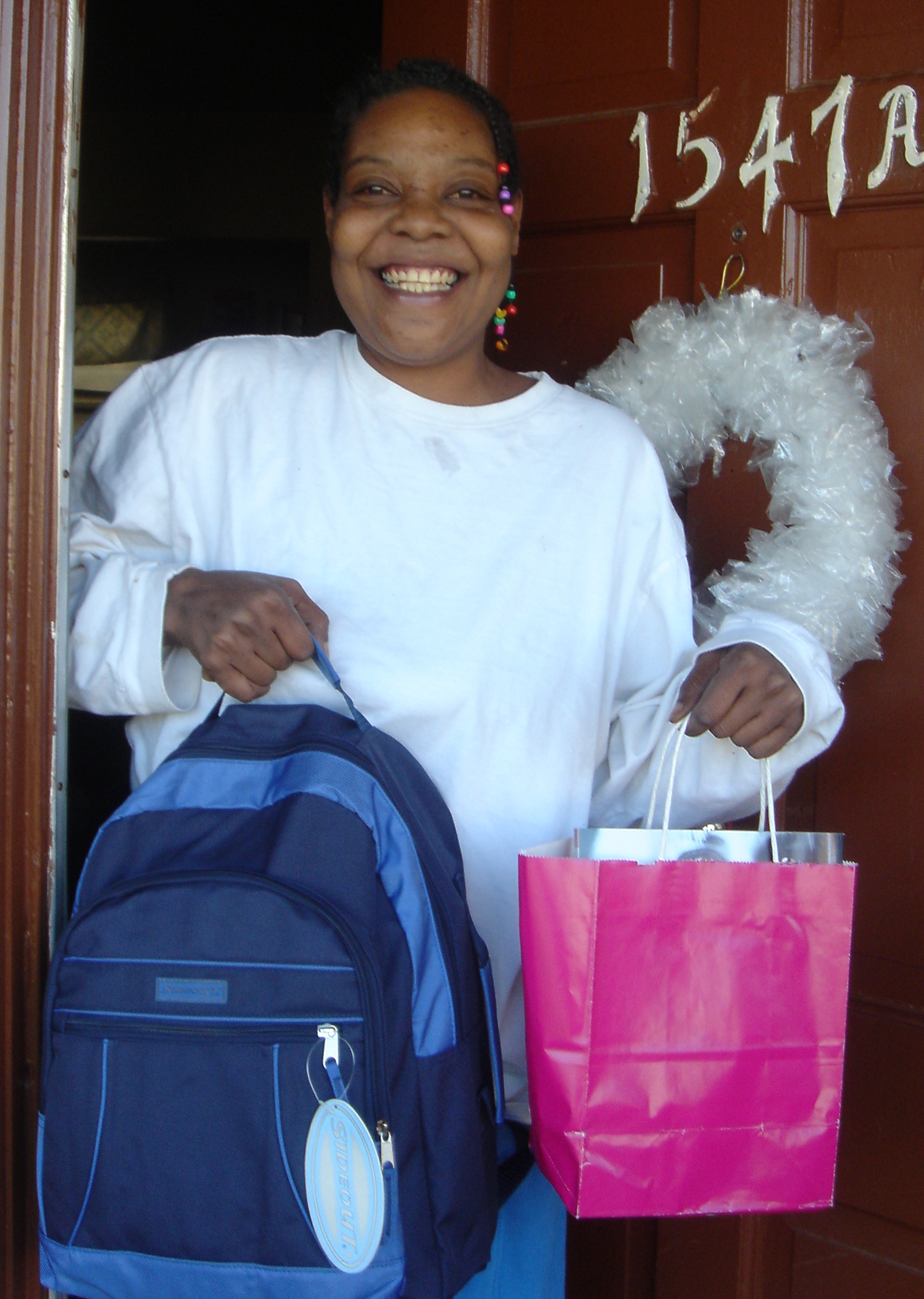 Smiles from this Mom at the front door, when gifts arrived unexpectedly