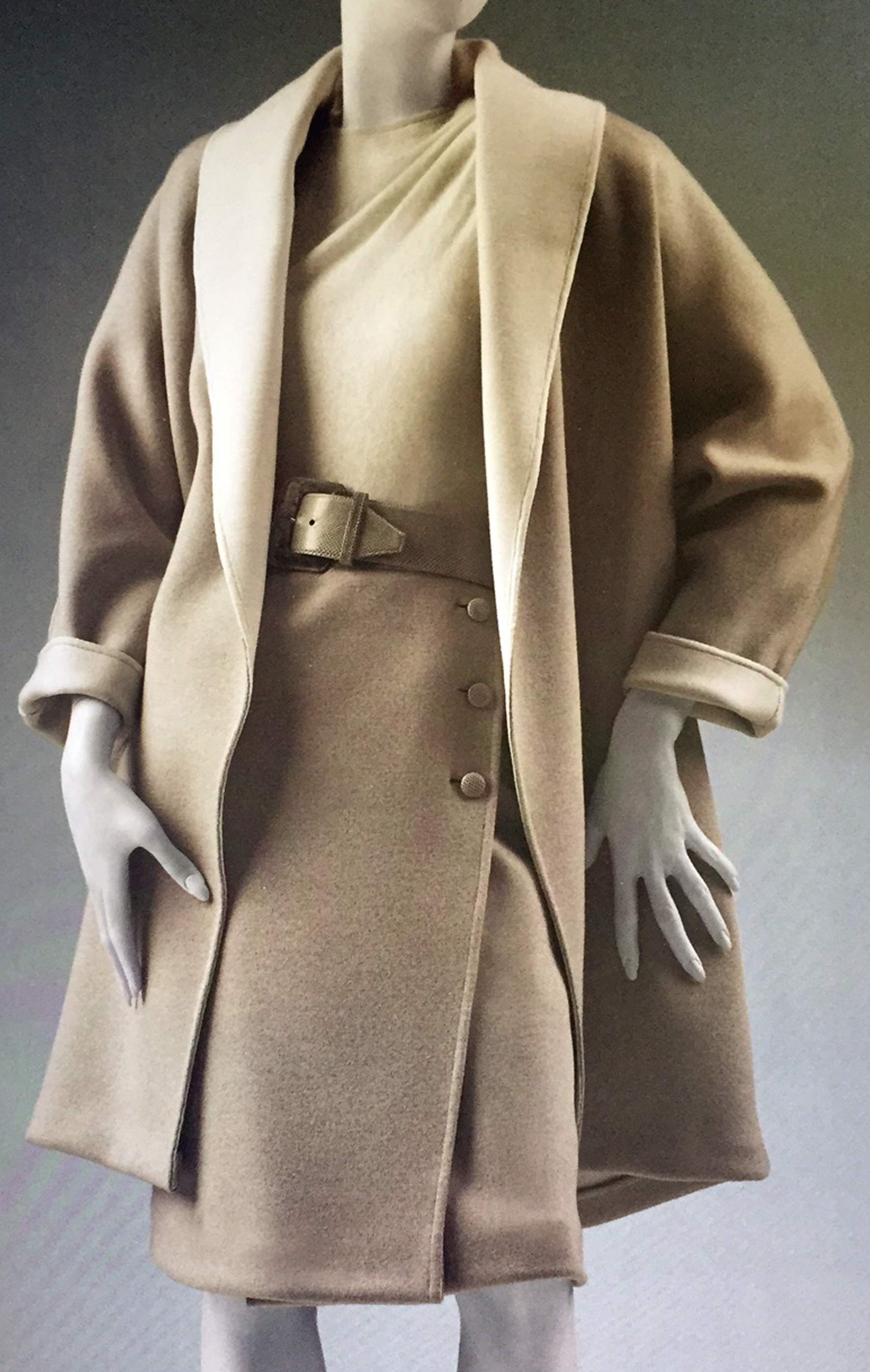 An Oscar de la Renta wool suit and cashmere sweater with gathered shoulder detail and belt is one of the pieces from the WRJ-designed exhibition that Mrs. Reagan wore while in the White House.