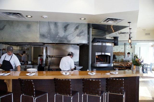 Arch11’s open kitchen design for the award-winning Oak at Fourteenth highlights the growing trend toward experiential dining where customers can see their food prepared.  (Photo: courtesy of Arch11)