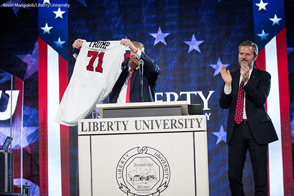 Liberty University President Jerry Falwell presents Donald Trump with a Flames football jersey on Jan. 18, 2016.