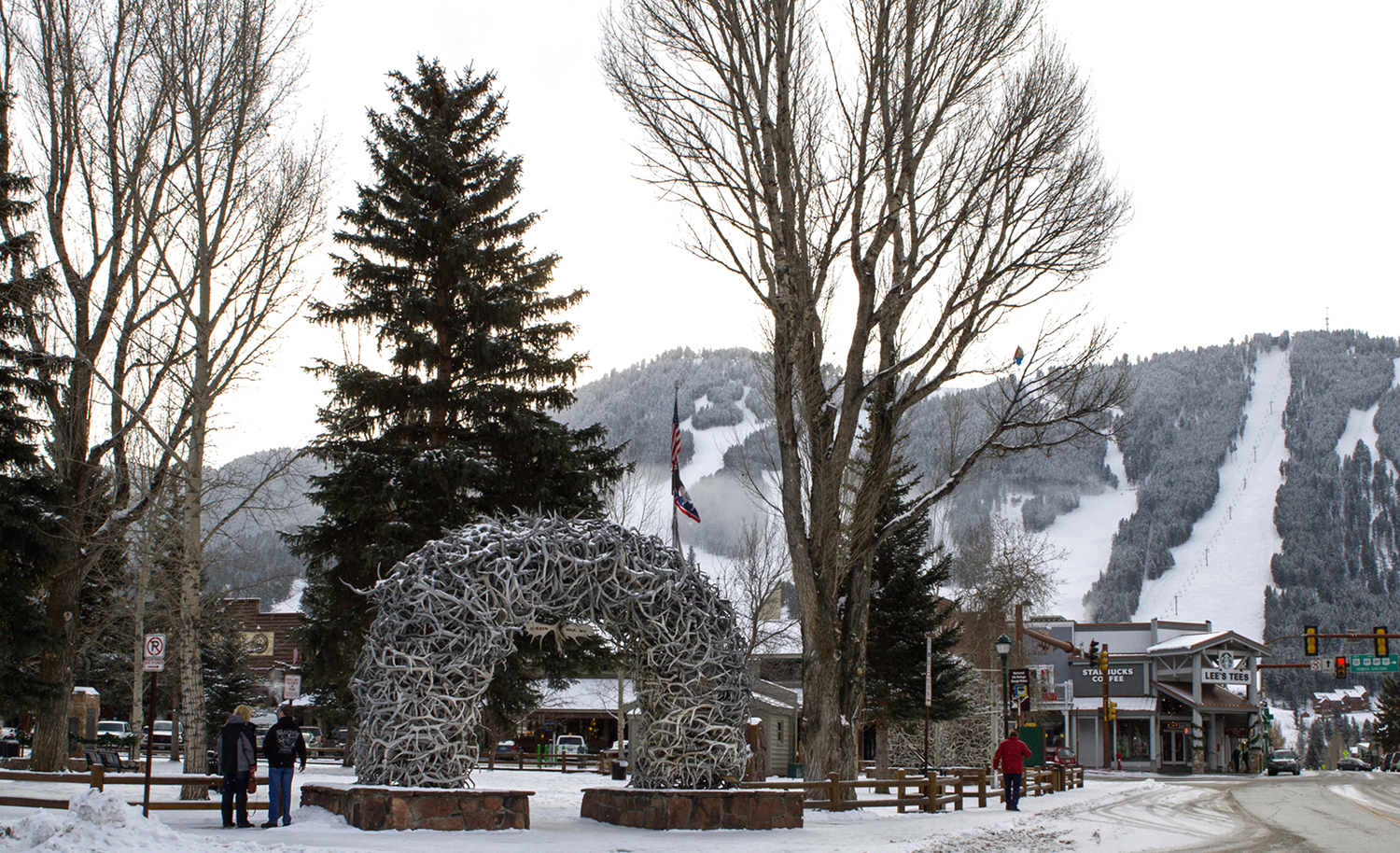 Jackson Town Square with its iconic elk antler arches hosts ice skating throughout Jackson Hole WinterFest, while Snow King Mountain is the venue for events including slalom ski racing.