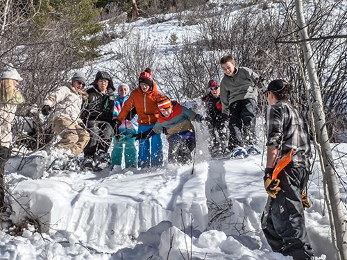 Students completing a snow stability test during a snow science field program with 8th graders from Vail.