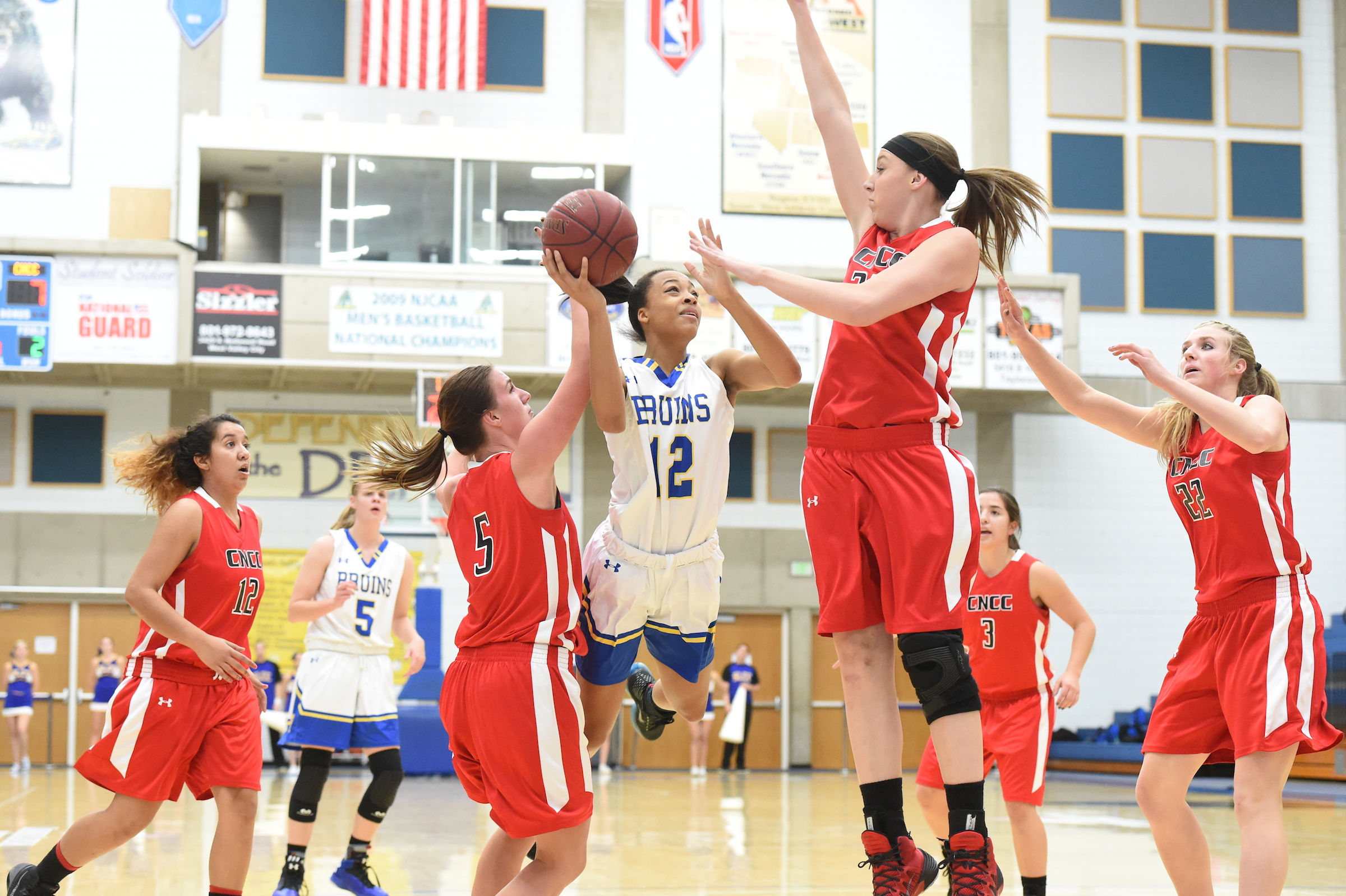 Monique Mills muscles her way toward a layup.