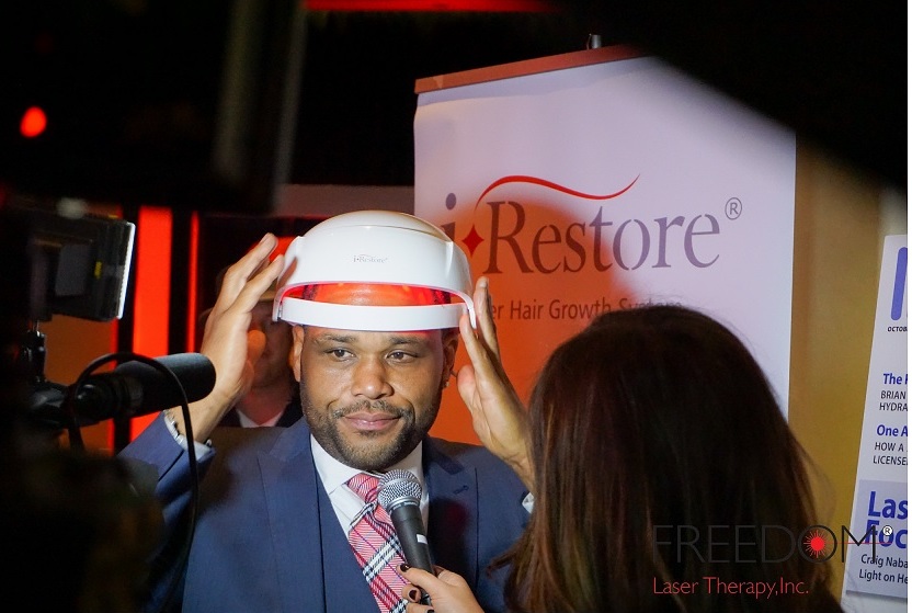 Anthony Anderson of Blackish wearing the iRestore Laser Hair Growth System