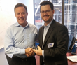 Booker SVP of Marketing Jim D'Arcangelo (L) accepting his 2016 BIG Innovation Award from Business Intelligence Group Managing Director Russ Fordyce (L) in New York City