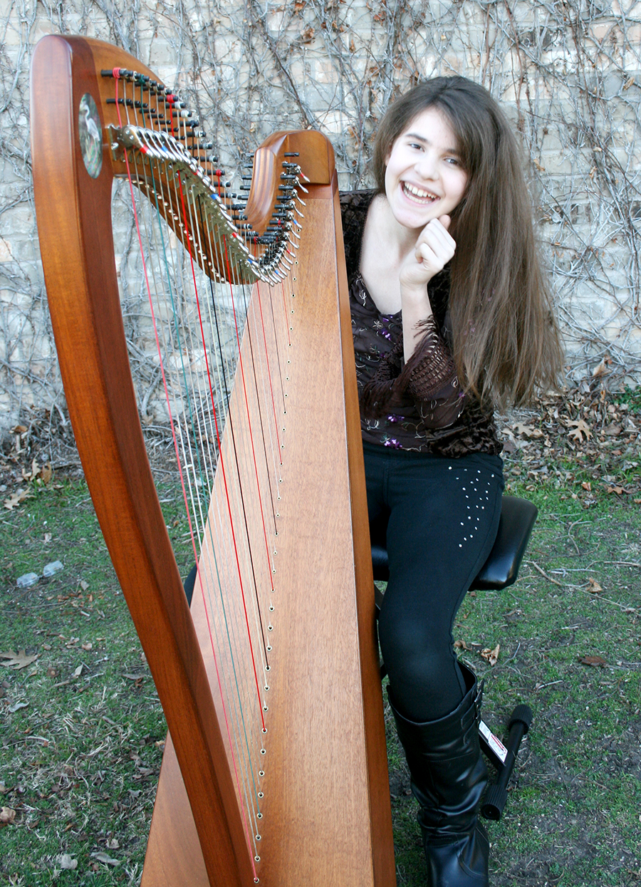 Sarah Copus with her magical harp Hermione