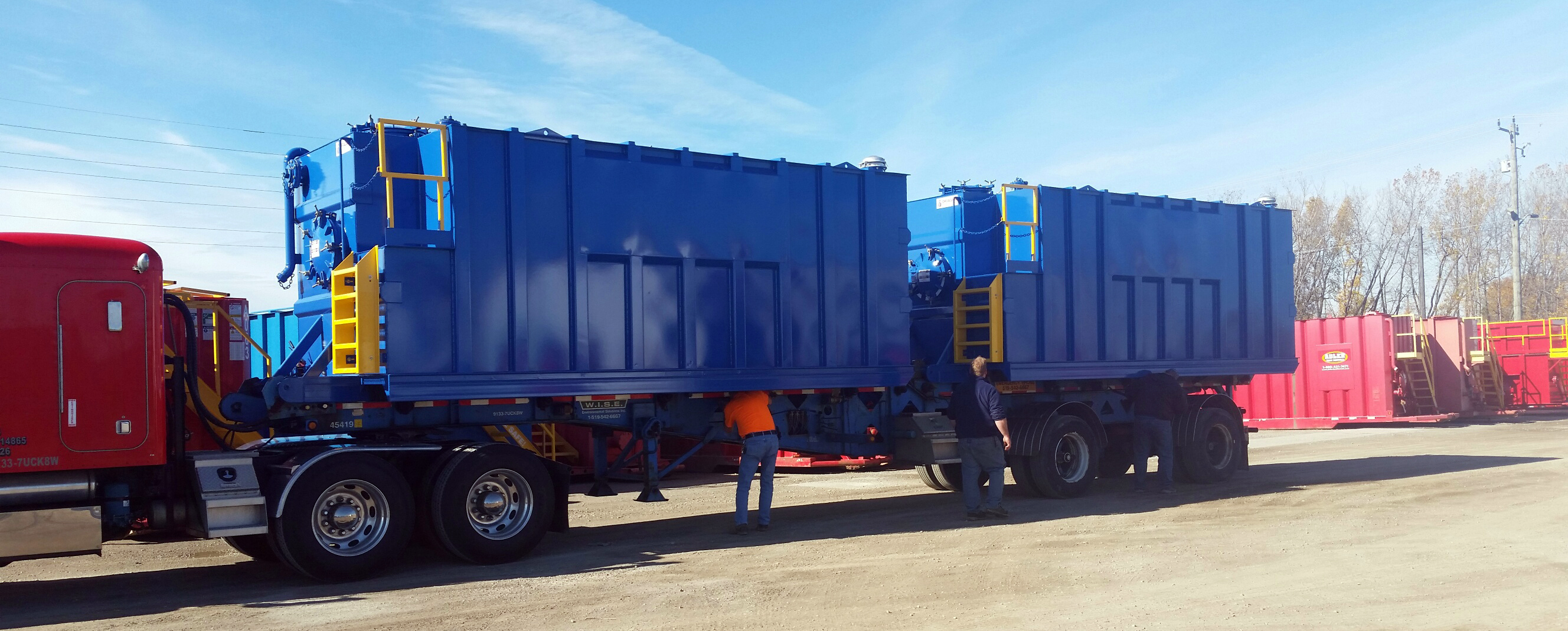 Two Mini Frac tanks loaded on a two-container trailer all manufactured by Dragon. Dragon Products, LTD  will debut their Mini Frac tanks during the annual Water & Wastewater Equipment, Treatment & Tra