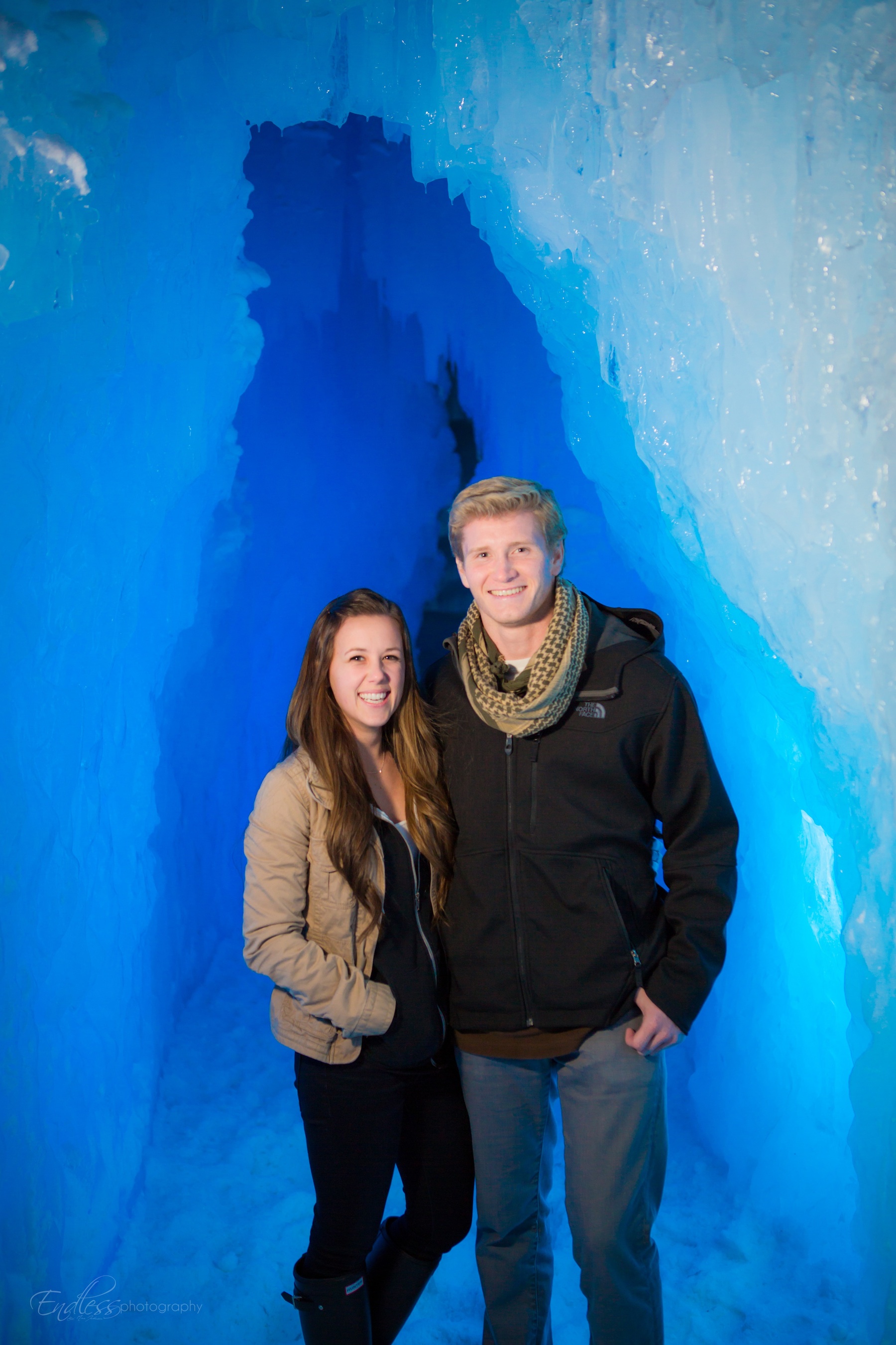 A couple after getting engaged at the Ice Castles.