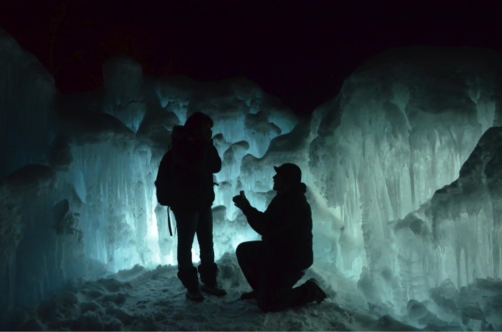 A couple gets engaged at the Ice Castles.