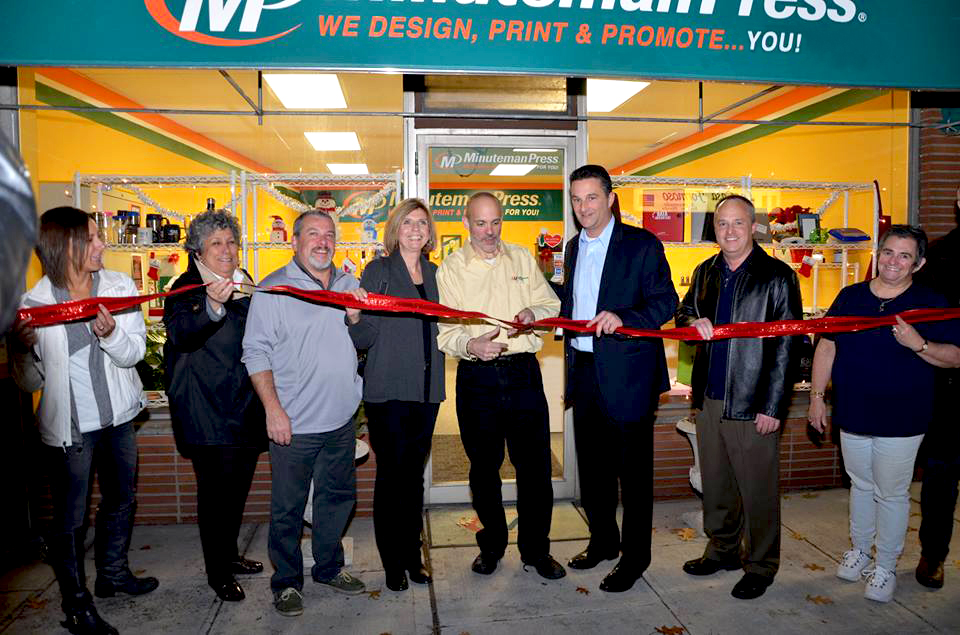Alan Schneider cuts the ceremonial ribbon as he celebrates the move of his Minuteman Press franchise in Northvale, NJ to its brand new location at 202 Livingston Street