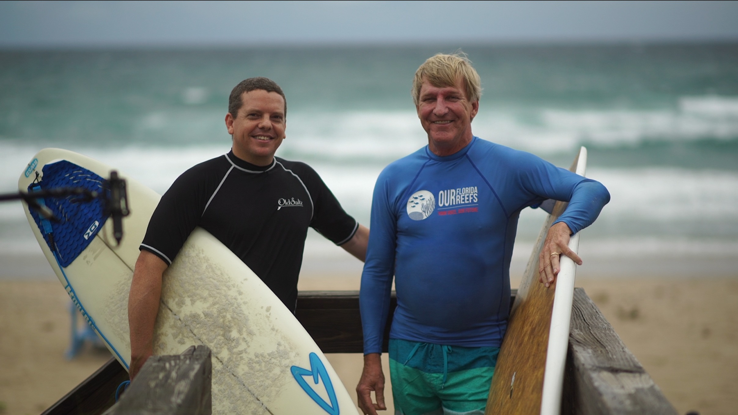 Todd Remmel, left, Tom Warnke right, of Surfrider Foundation Palm Beach Chapter speak out about sea level rise