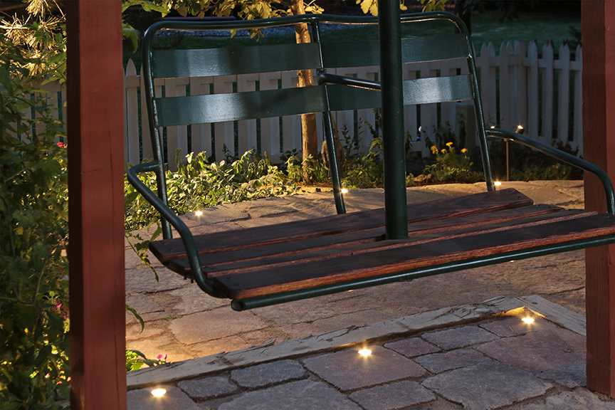 Add accent lighting to an outdoor environment to create a dramatic effect.
