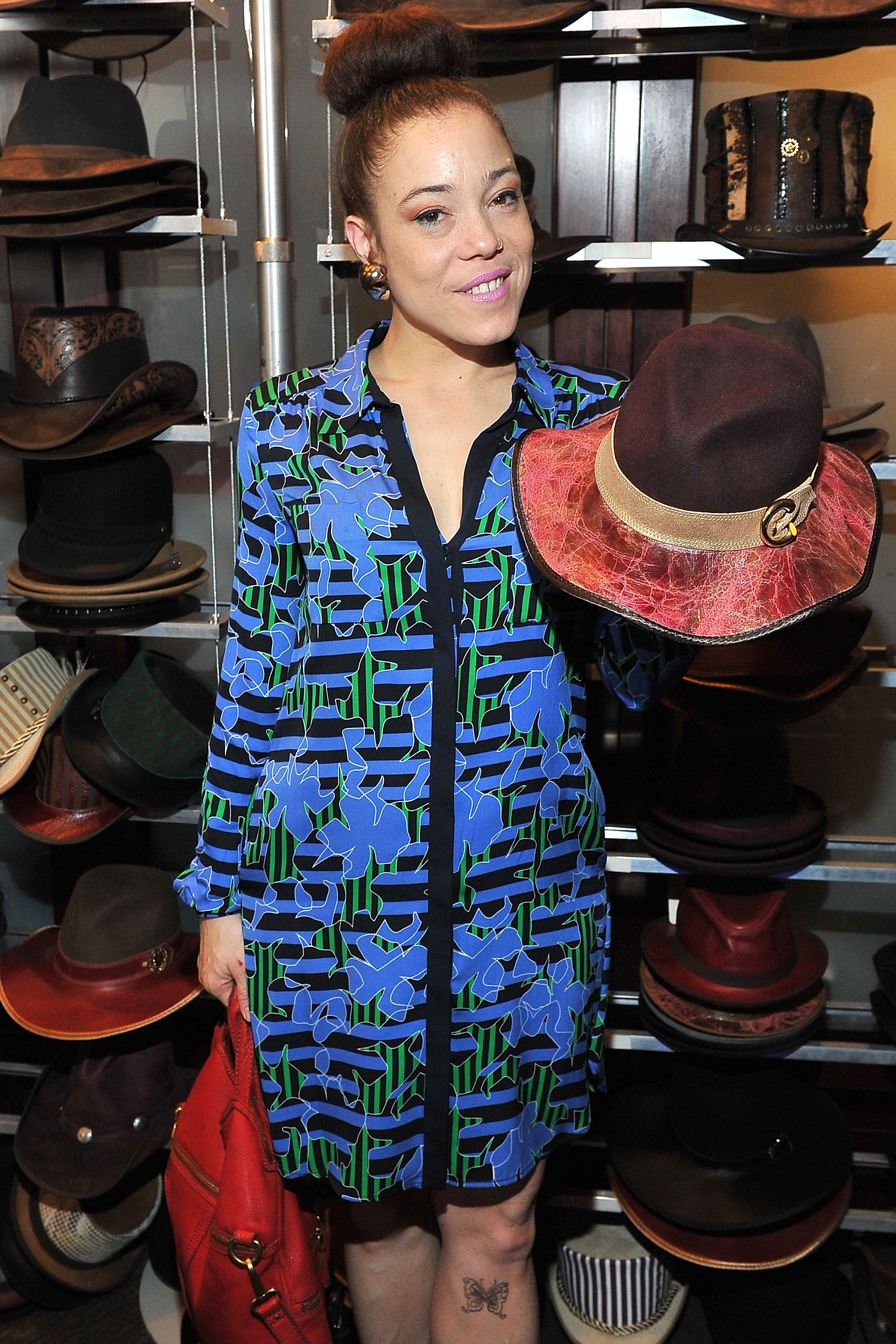 Grammy Winner, Kendra Foster, loving her custom made American Hat Makers at the 2016 GBK Pre-Grammy Lounge.