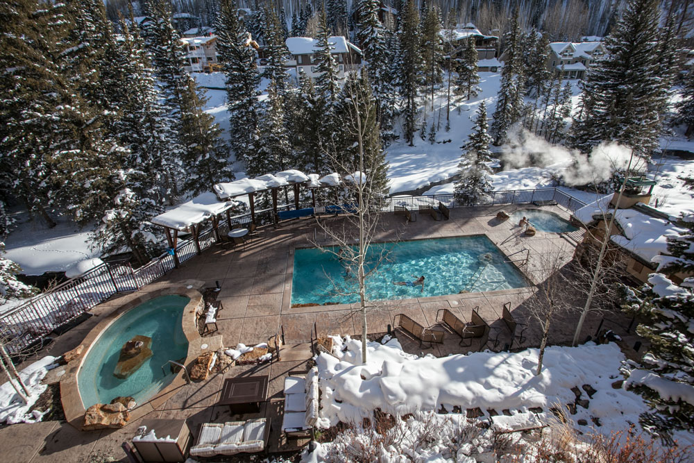 An outdoor pool - with two hot tubs - offers another favorite amenity for family ski vacations at the Antlers at Vail hotel in Vail, Colorado.