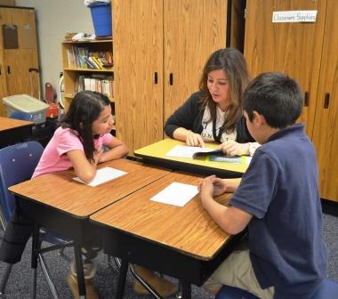 PIMCO Volunteer reading with THINK Together students