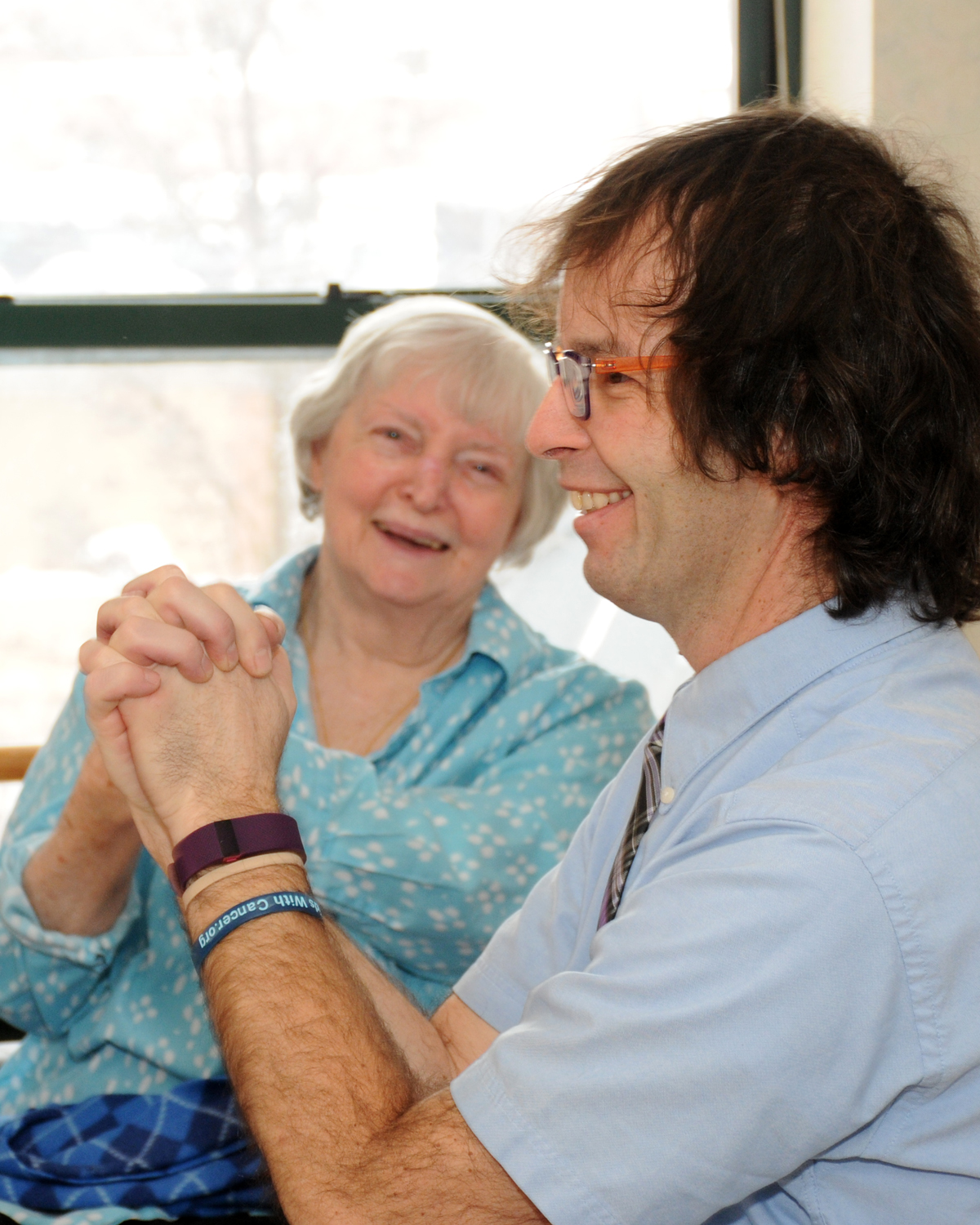 Personal trainer Wayne Cushing shares a lighthearted moment with Allerton House resident Nancy Sullivan during an activity scheduled for the community’s recent Heart-Healthy Day.