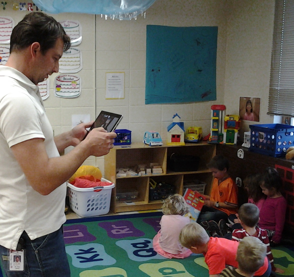 Shown above:  Travis Bauermeister, Amery School District, photo-documents students during an activity