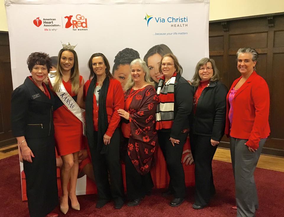 Just some of the Wichita, KS Chapter women posing in front of the step-and-repeat.