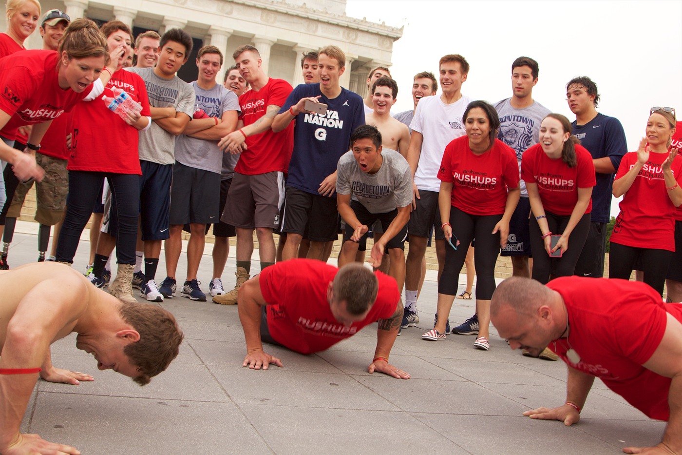 Students from Georgetown University participate in Boot Campagin's Pushups for Charity