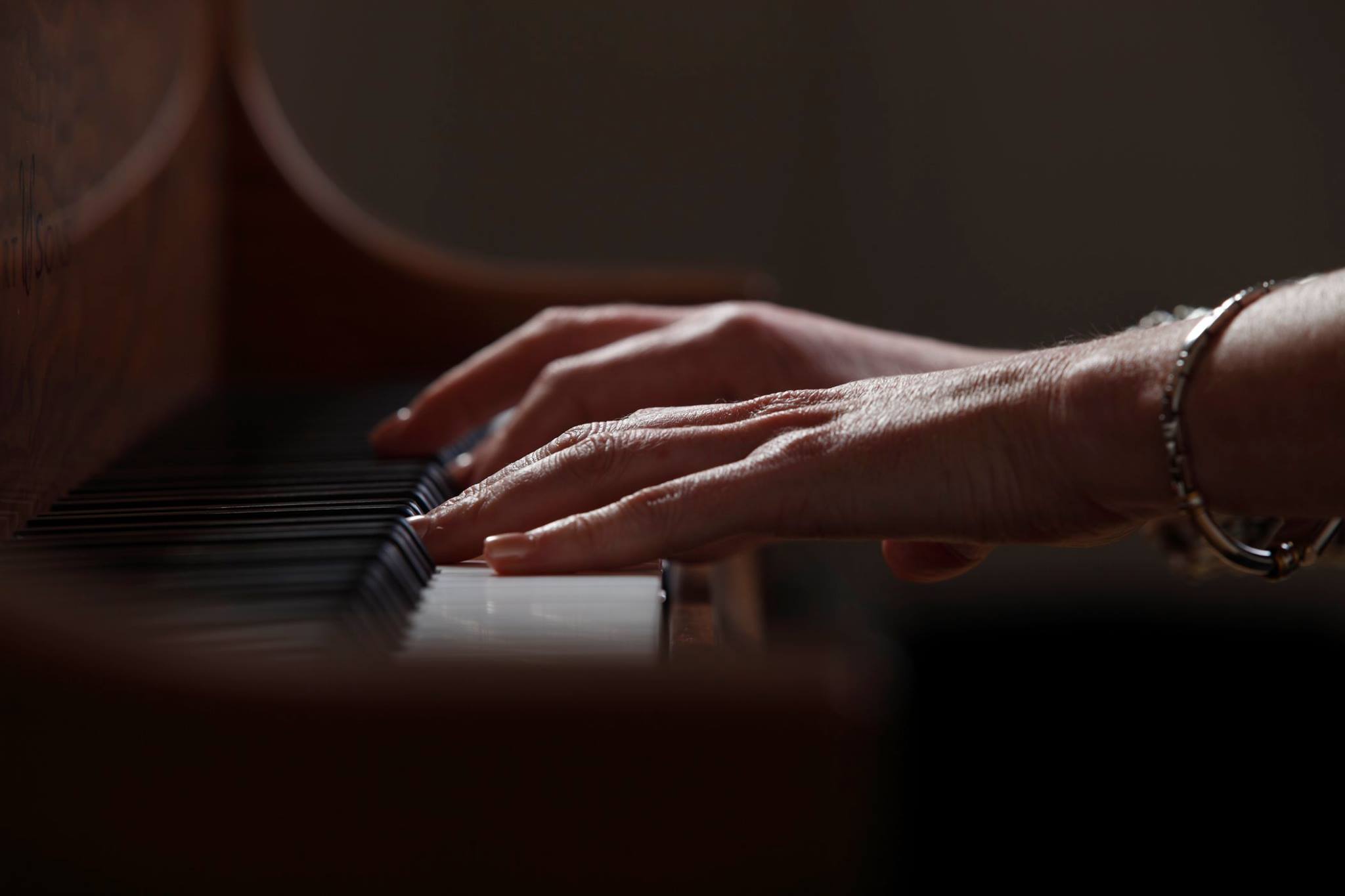 Fiona Joy, hands on piano.