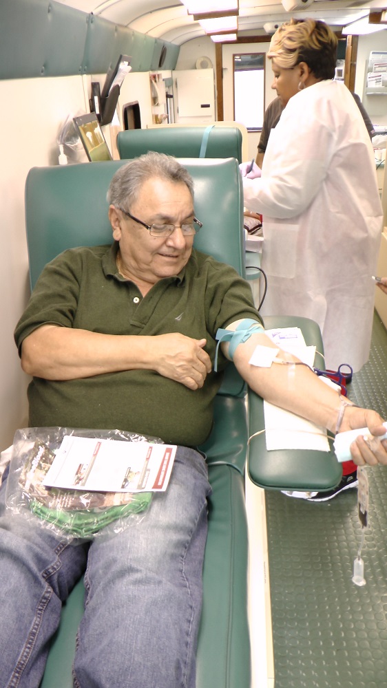 Uniweld employees are happy to donate when the Big Red Bus arrives!