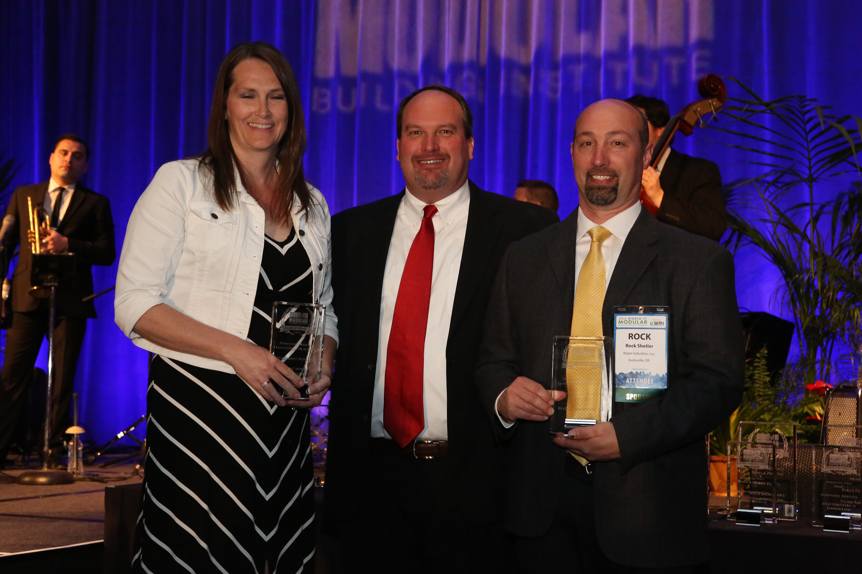 Gretchen Moore, CFO (left) accepts award, along with Manufacturer Rock Shetler (right) of Blazer Industries, Inc.Photo Courtesy: Modular Building Institute