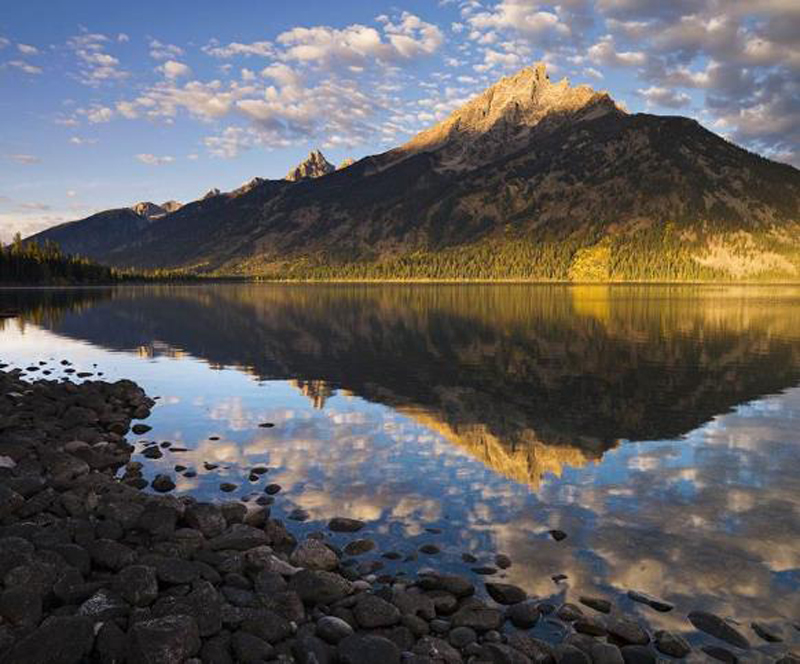 Ed Riddell’s fine art photography often takes as subject matter the Wyoming landscape, as with this image, “Jenny Lake Sunrise.” © Edward Riddell