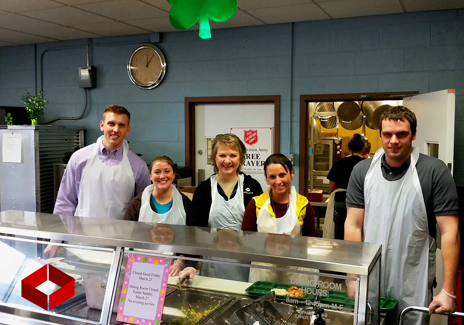 Enclave Development team members serve lunch for the hot meal program, sponsored by the Fargo Salvation Army